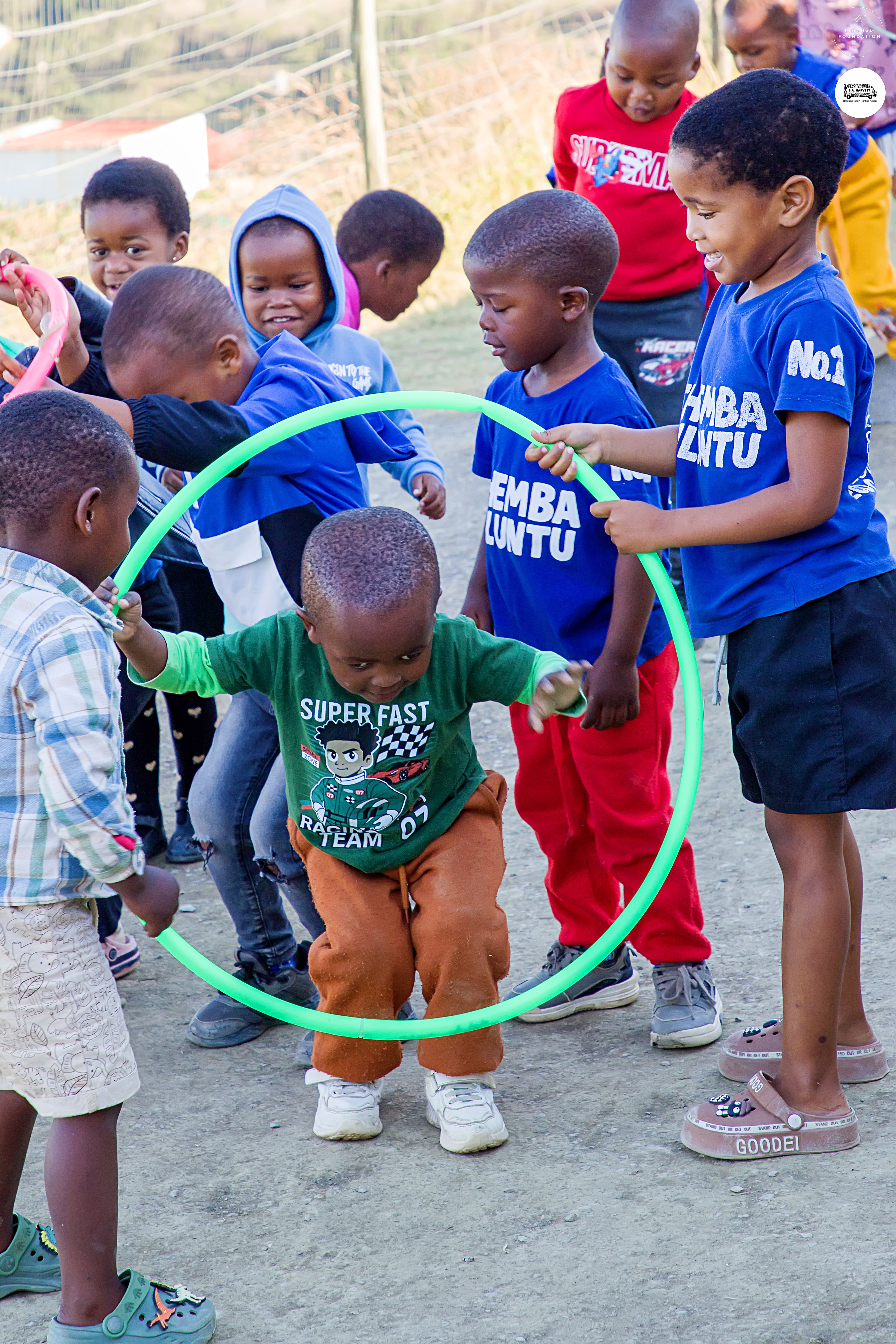 Children playing together with a ring