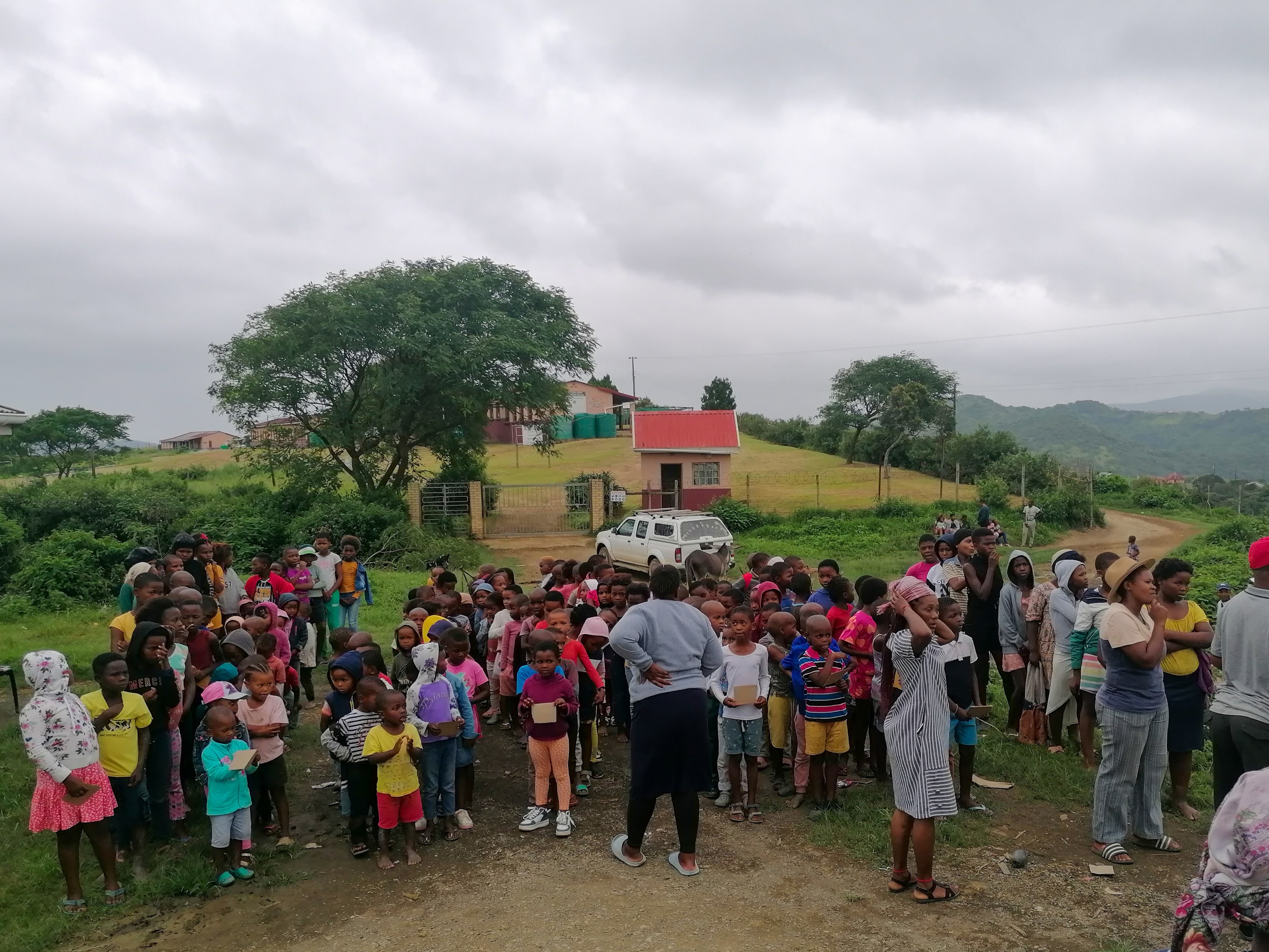 Community gathering for a Disaster Relief distribution in Cwebeni