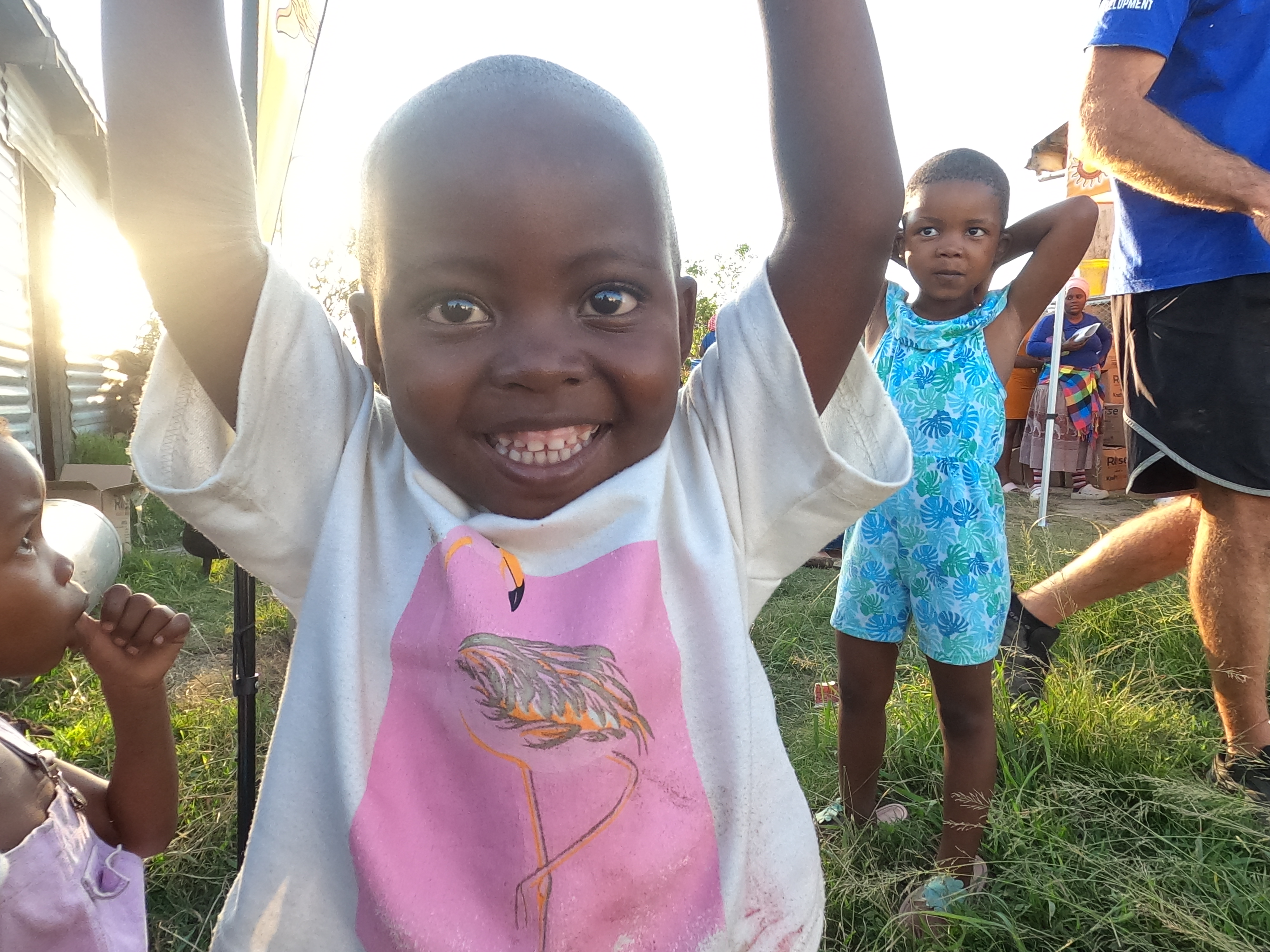Smiling child at a community support event