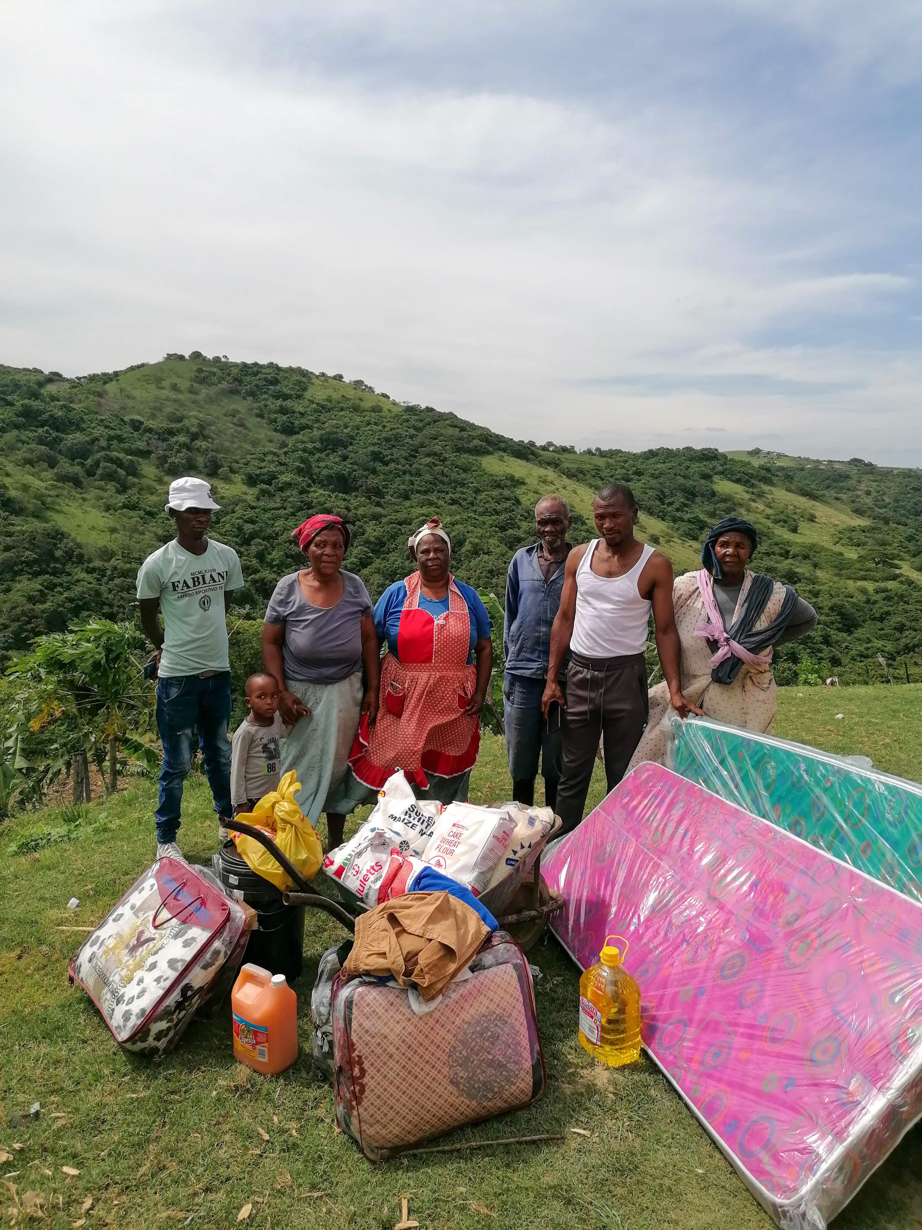 Family receiving a mattress, food and household supplies