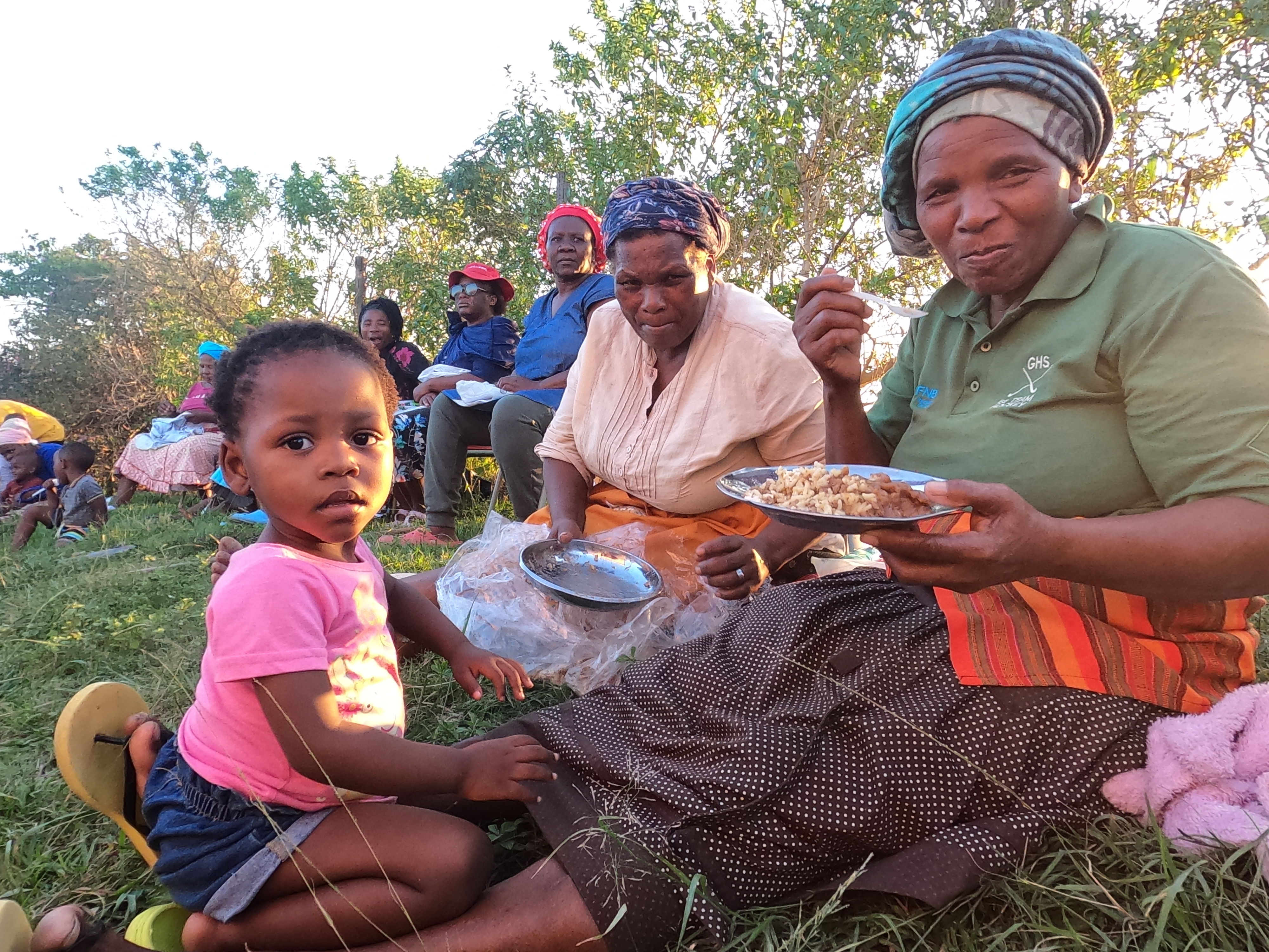 Mother and child sharing a community meal