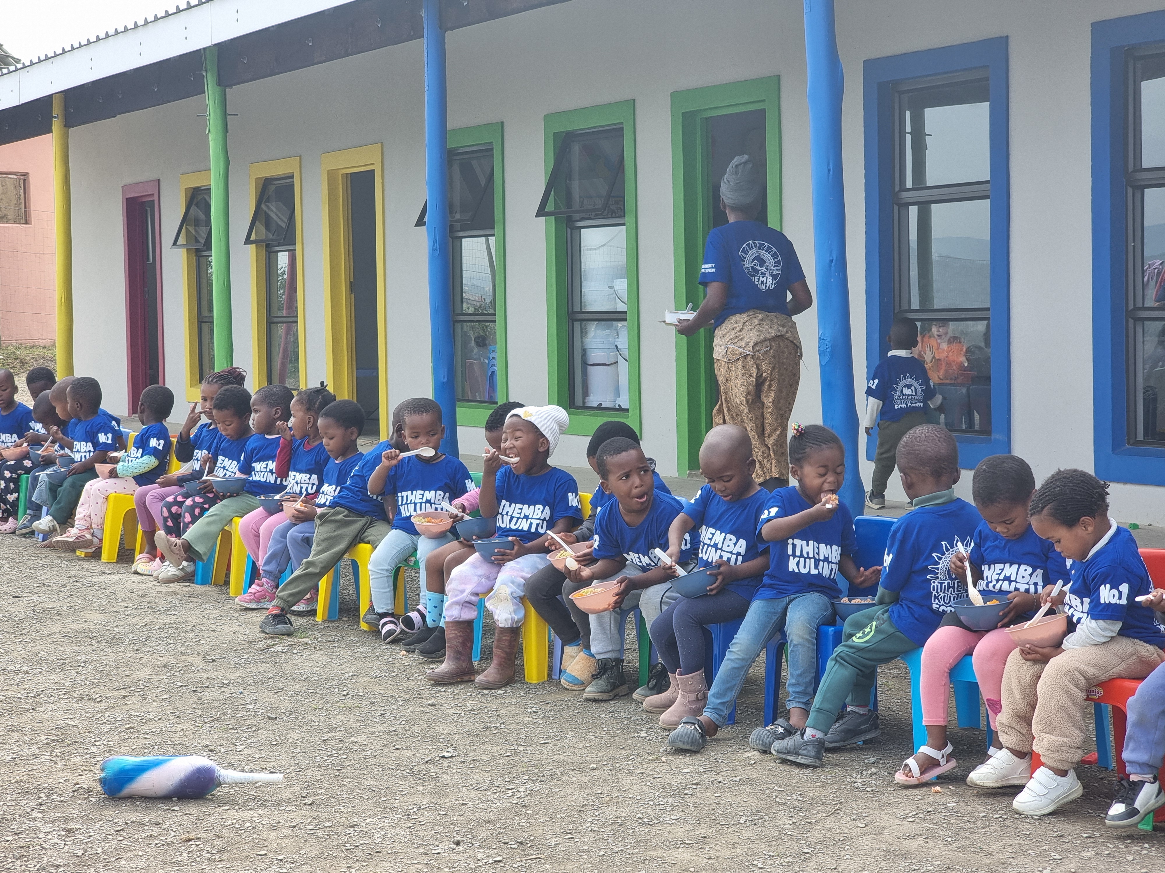 ECD children eating in a row