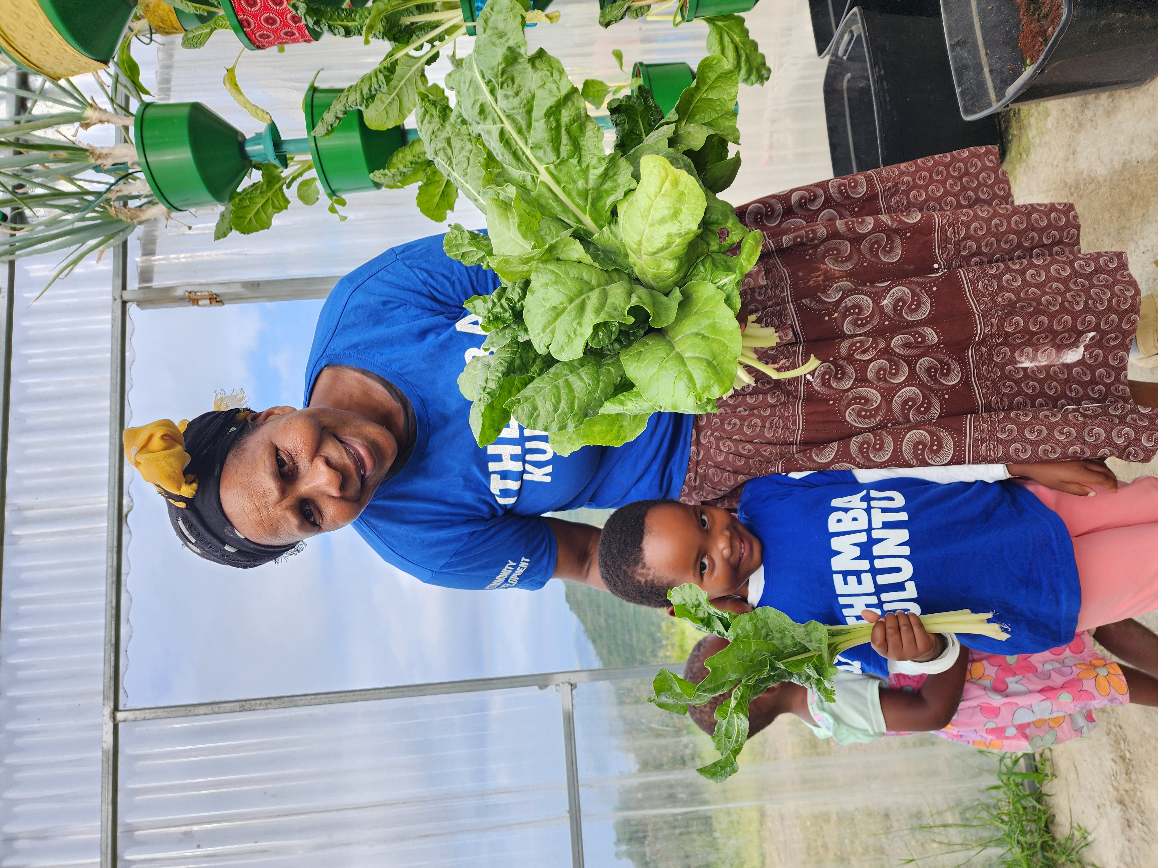 Teacher and child harvesting together