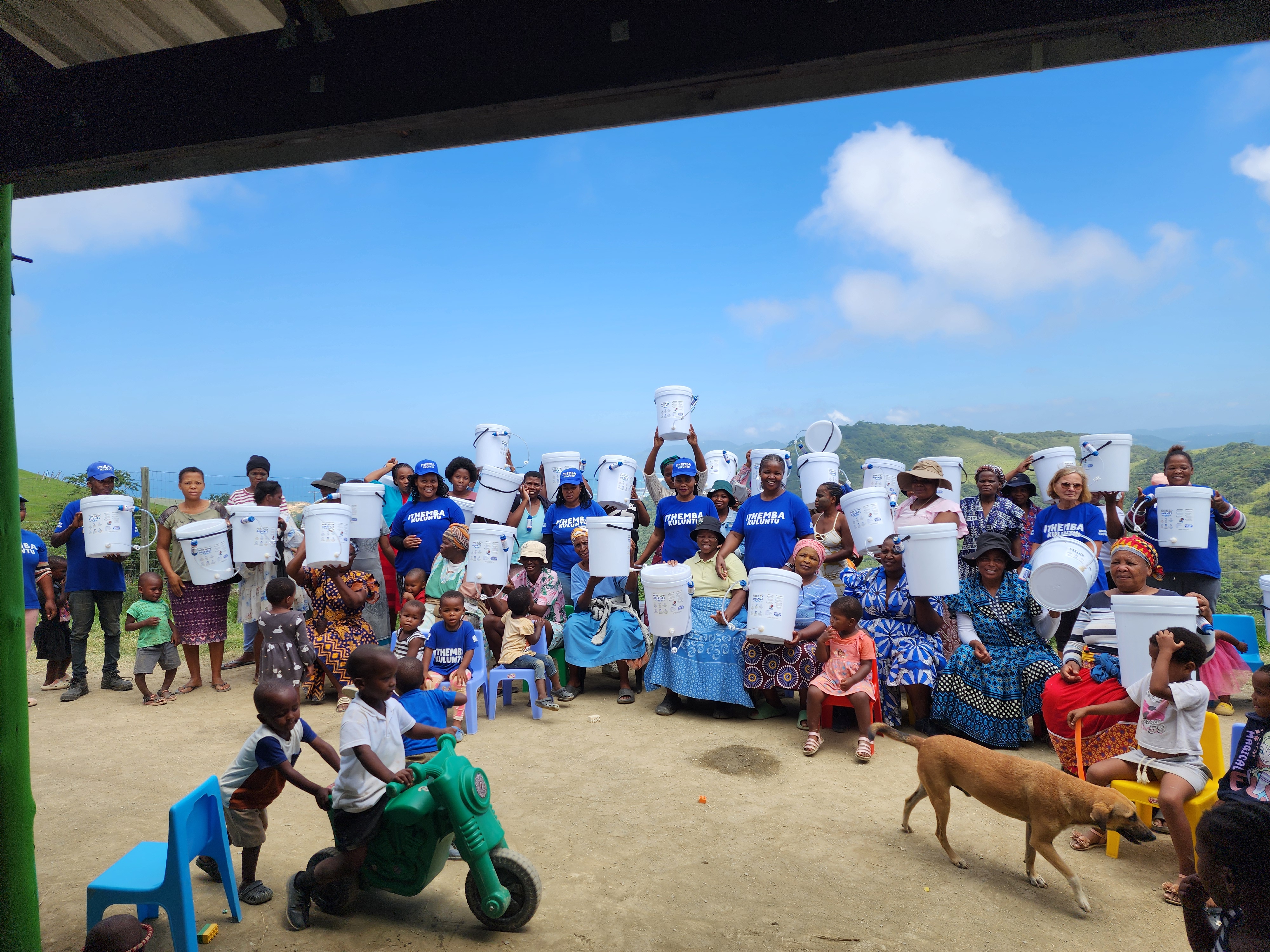 PureFlow Amanzi community members with household water filters