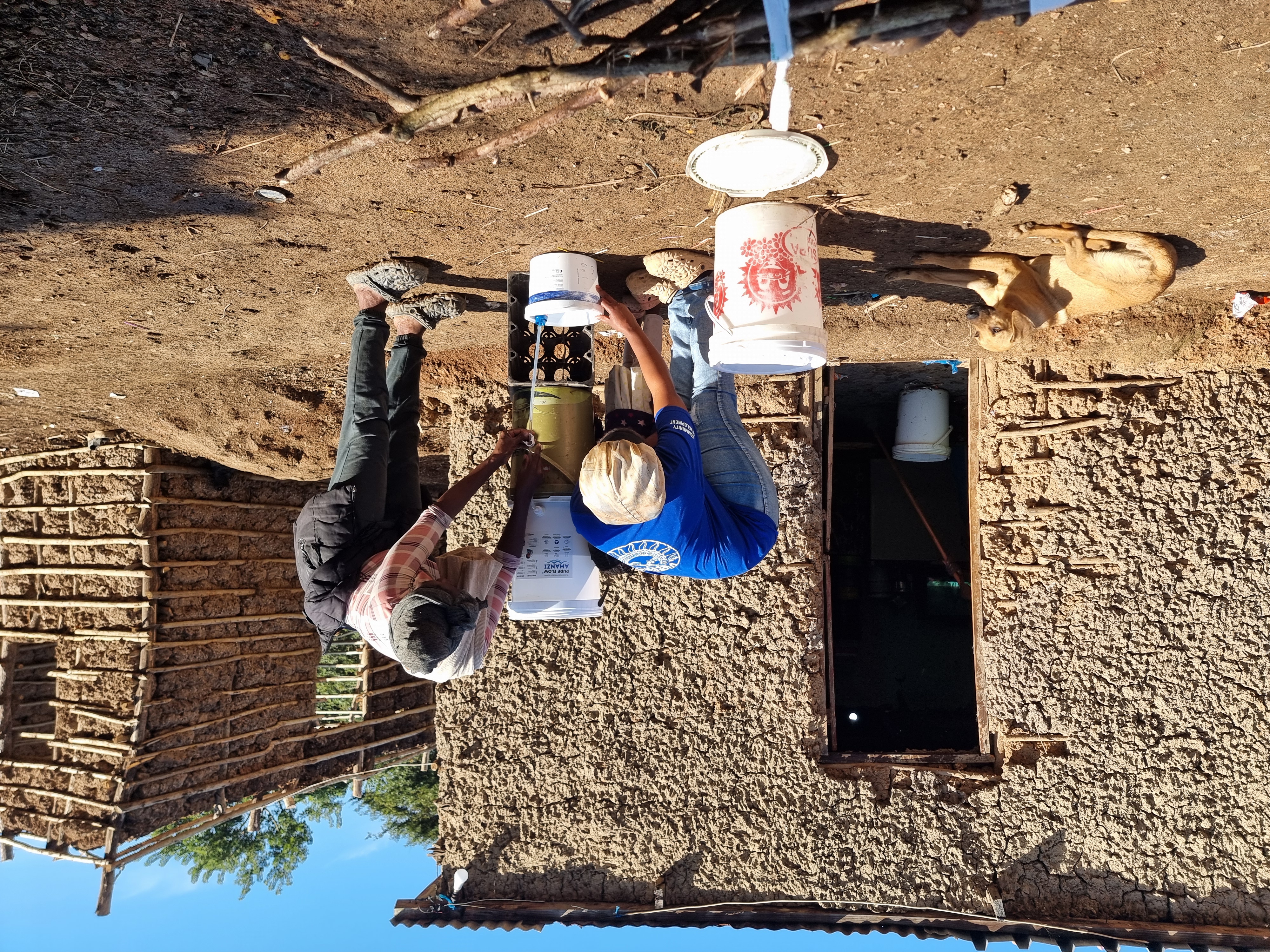 Family learning how to install and use a PureFlow filter