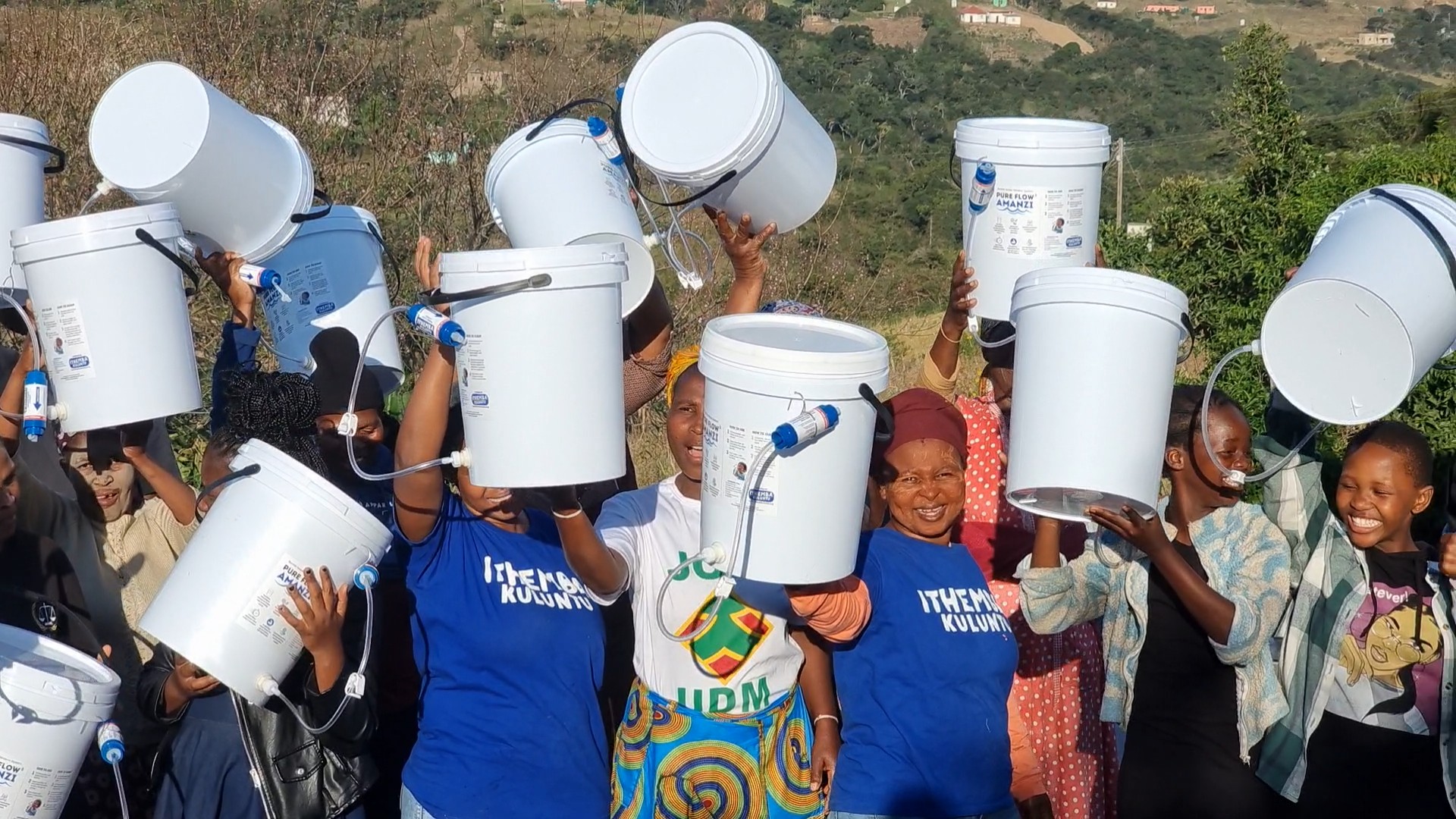 PureFlow Amanzi community members with household water filters