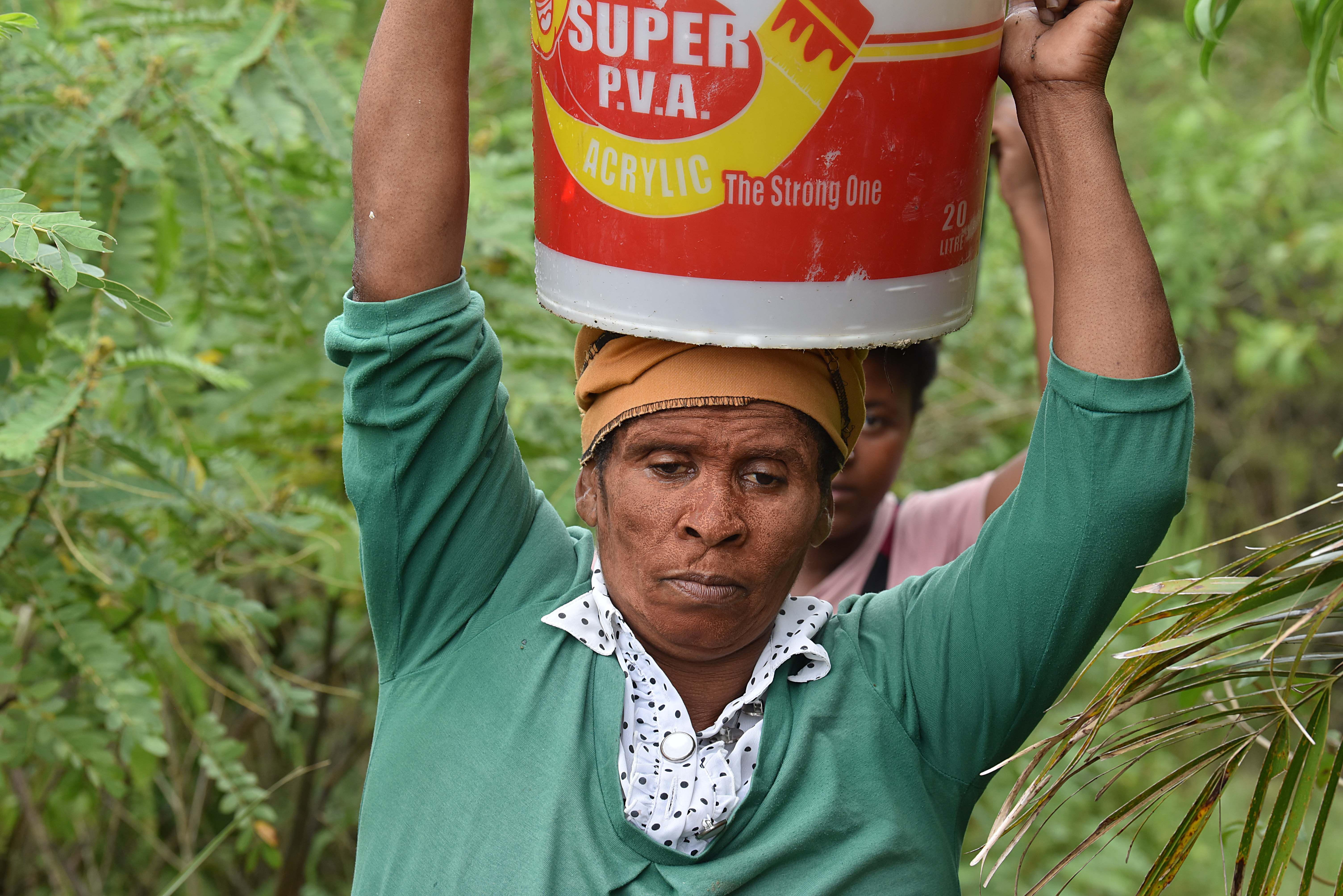 Women in rural Pondoland carrying the daily burden of unsafe water